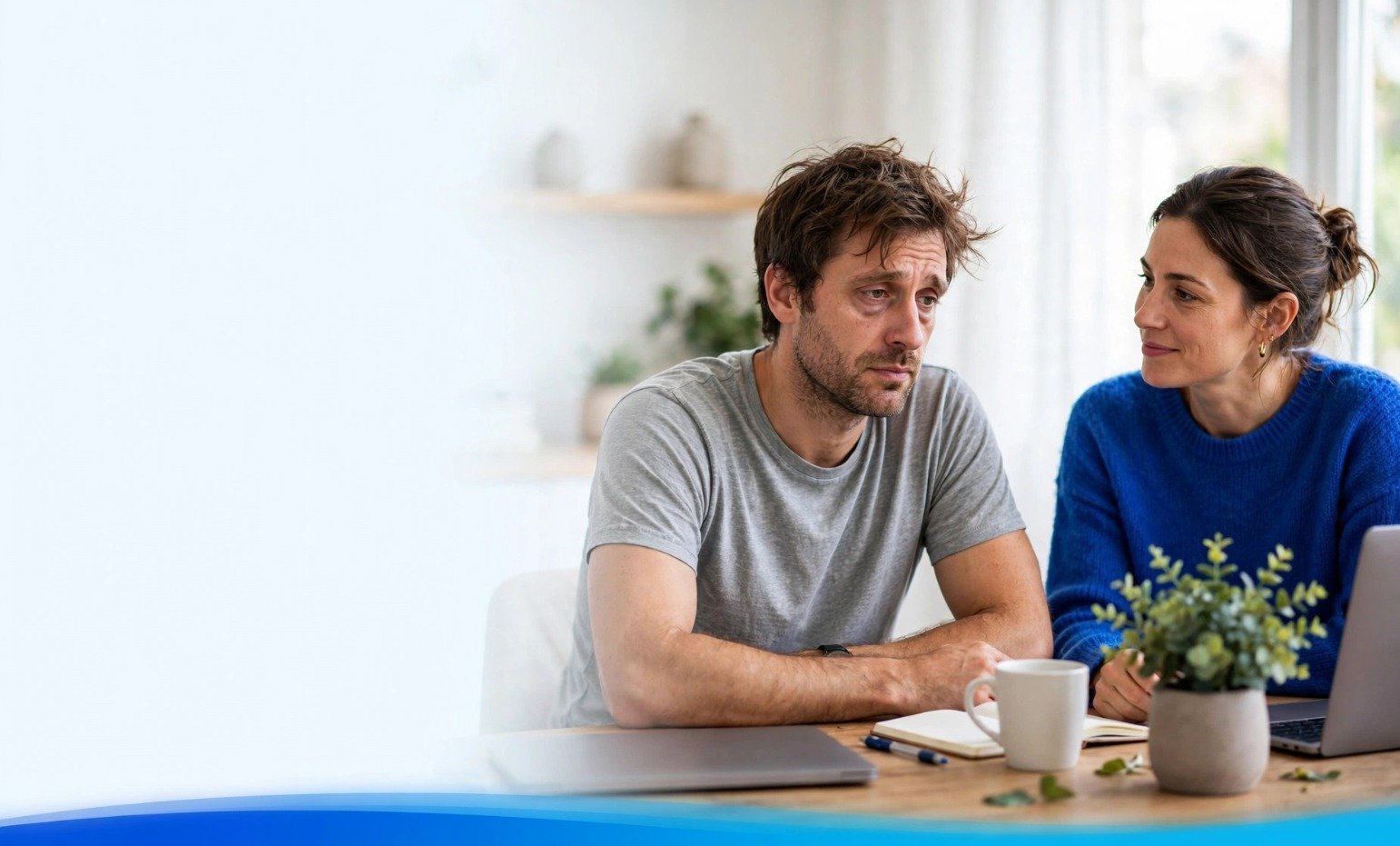 Two friends having a supportive conversation in a bright home office, illustrating empathetic ways to say hang in there.